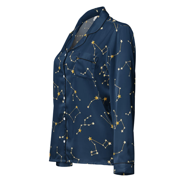 Navy blue shirt with gold constellation pattern on a white background