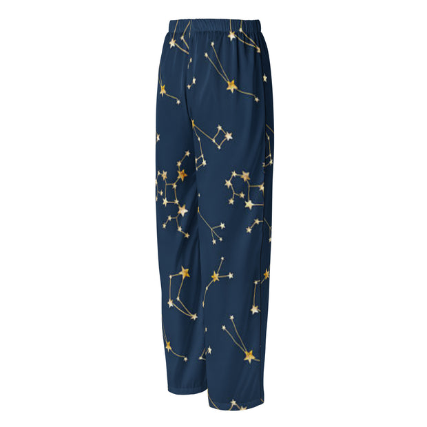 Navy blue pants with gold star constellation pattern on a white background