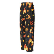 Black pajama pants with orange zodiac symbol pattern on a white background