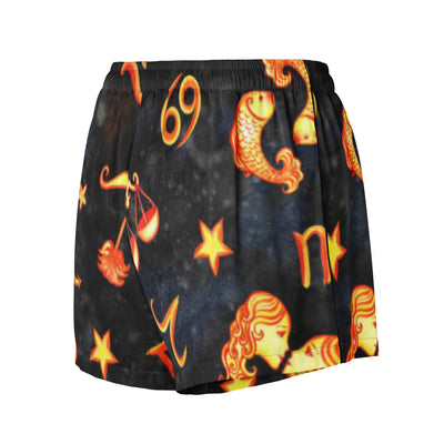 Black shorts with orange and yellow star signs and symbols on a white background