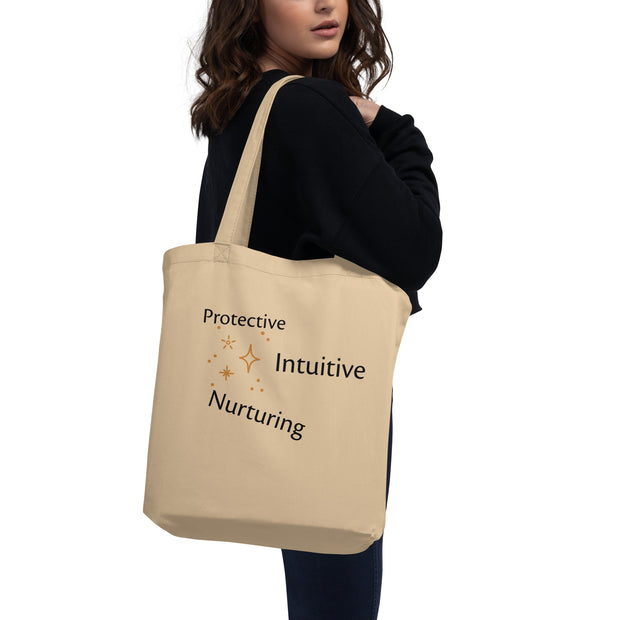 Person holding a beige tote bag with text on a white background