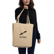 Person holding a beige tote bag with 'Sagittarius' design on a white background