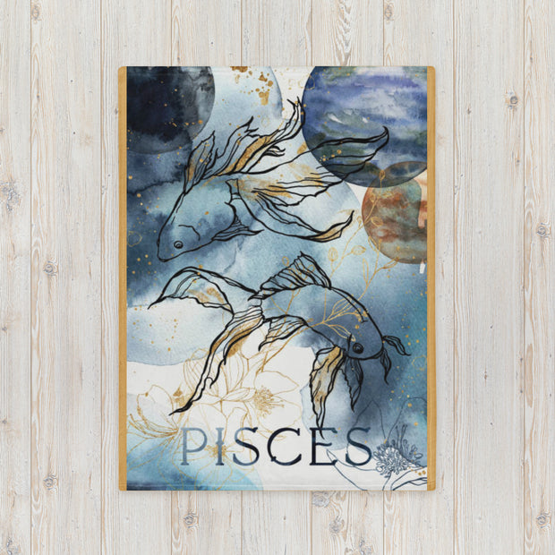Framed artwork of Pisces zodiac sign with stylized fish on a wooden surface